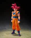 Action figure of a character in orange and blue outfit with red hair on a dark background