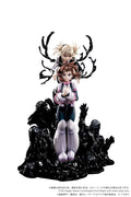A collectible anime figurine of two characters posed on a black base with antler-like and shadow-like sculpted details, photographed against a plain white background. The front-facing character wears a white, pink, and dark blue outfit with pale lavender legs, while the rear character has blonde hair and is partially obscured by black antler shapes.