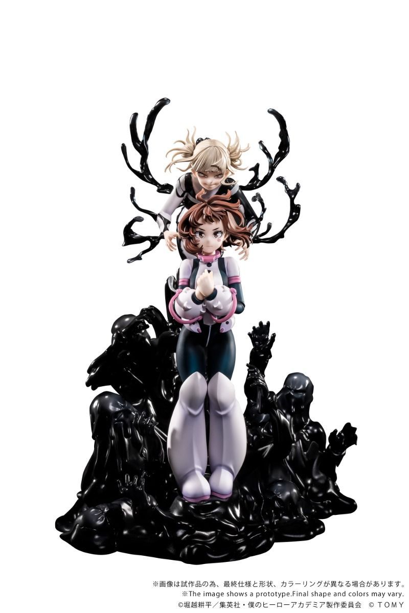 A collectible anime figurine of two characters posed on a black base with antler-like and shadow-like sculpted details, photographed against a plain white background. The front-facing character wears a white, pink, and dark blue outfit with pale lavender legs, while the rear character has blonde hair and is partially obscured by black antler shapes.