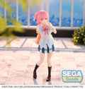 Anime character figurine with pink hair and a school uniform, standing outdoors with 'SEGA Goods' logo.