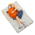Figurine of a character hugging an orange creature on a textured surface with 'Banpresto' branding.