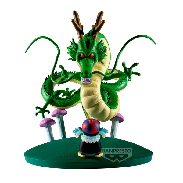 A Dragon Ball figure set on a white background, featuring a large green and yellow dragon with red eyes, pink and purple mushrooms, and a small character in front of a round green base. The Banpresto logo is visible on the base.