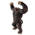 Action figure of a gorilla with raised arms on a white background