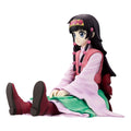An anime figurine of a seated female character with long black hair, wearing a pink and green outfit with red boots, photographed against a plain white background.