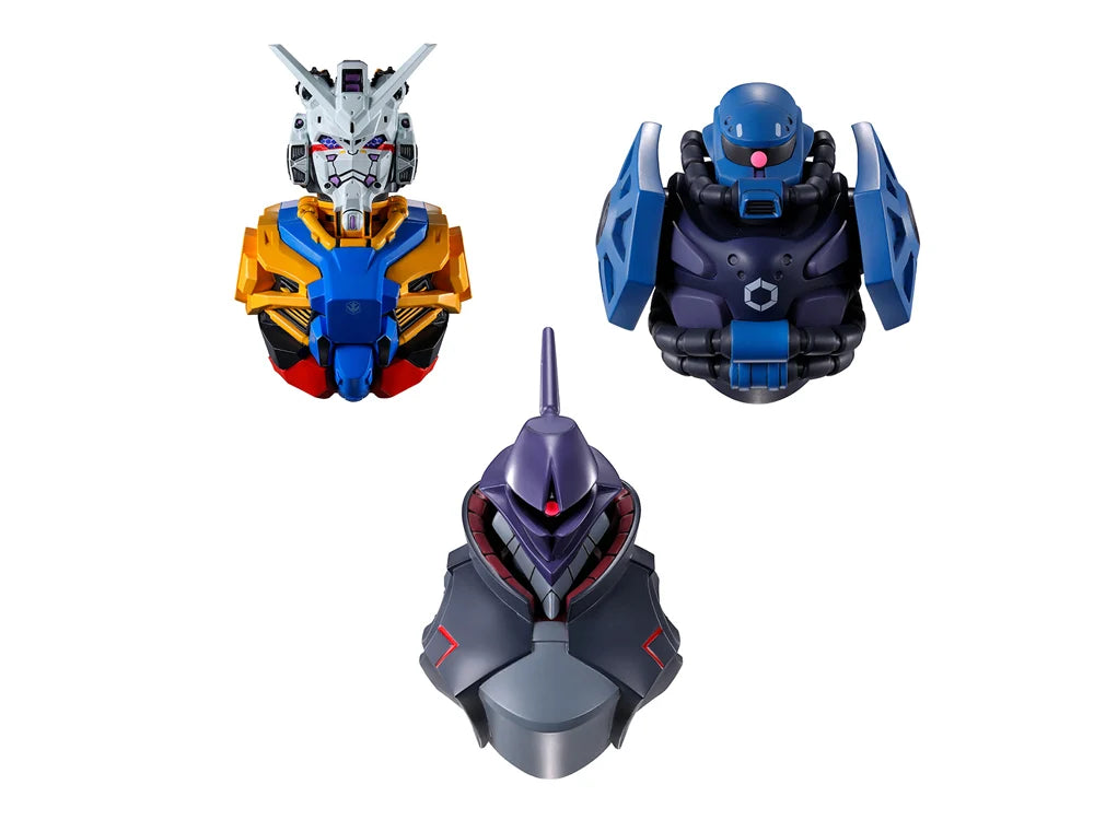 Three Gundam-themed bust figurines shown on a plain white background: a multicolored Gundam head and chest piece at upper left, a blue and dark gray robot bust at upper right, and a dark gray and purple mecha bust at lower center.