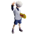 A collectible action figure of the character Killua from Hunter x Hunter, posed dynamically with one hand raised and holding a yellow arrow-shaped object, set against a plain white background.