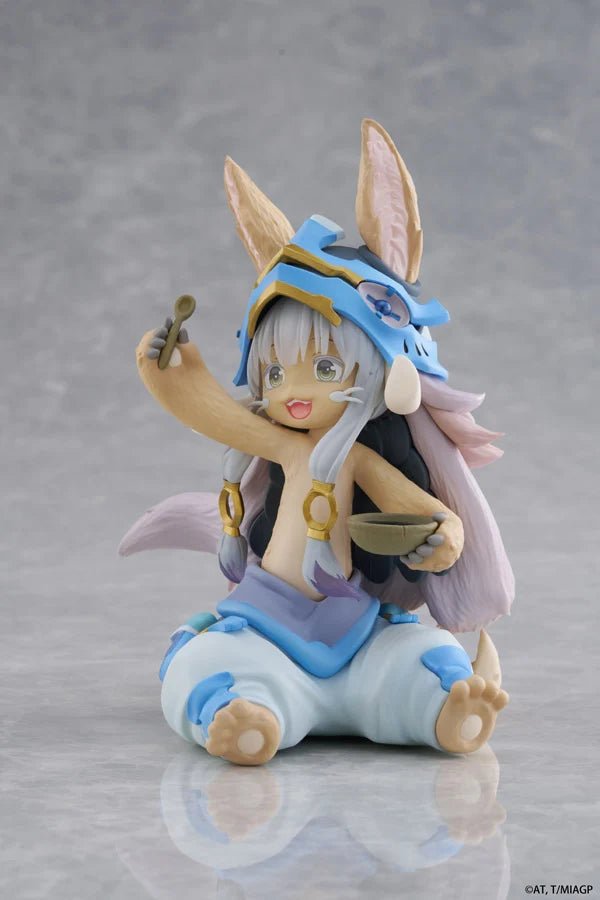 Animated character figurine with fox-like features on a gray background