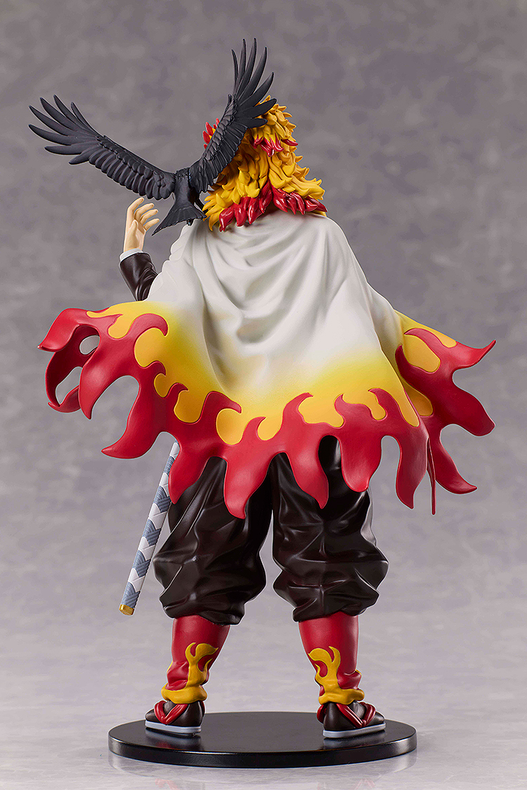Demon Slayer figure with fiery cape and bird on shoulder.
