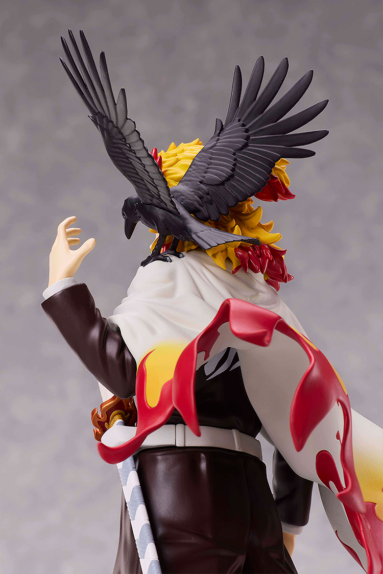 Figurine with a large bird on its back against a gray background