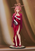 Figurine of a character in a red dress with a pink hair bow against a brown background