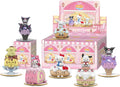 A set of Sanrio Hello Kitty and Friends dessert-themed collectible figurines displayed in front of their pink retail packaging on a white background.