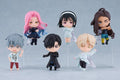 Set of small figurines with different hairstyles and outfits on a gray background