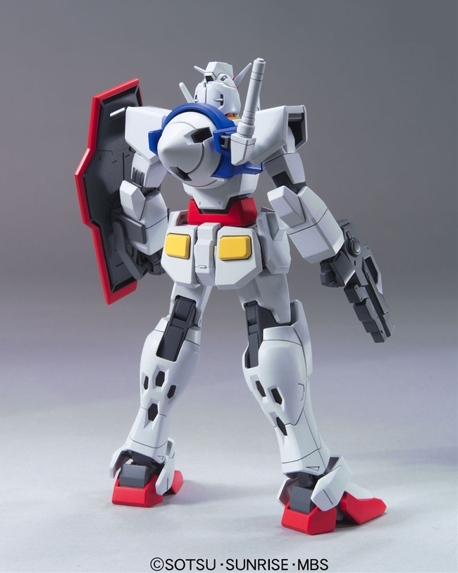 Model kit of a robot with a gray, white, and red color scheme on a gray background.