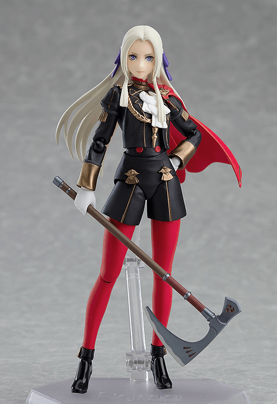 Action figure with long white hair, red cape, and holding a weapon on a gray background