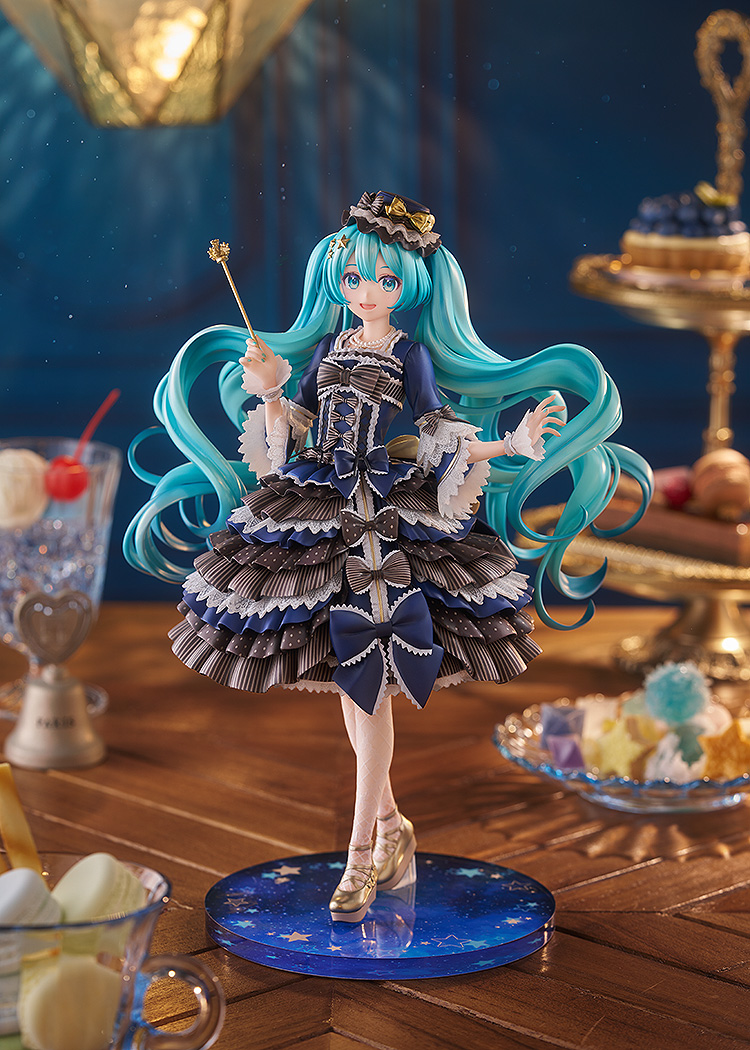 Hatsune Miku in blue, black and white dress with ruffles and bows.