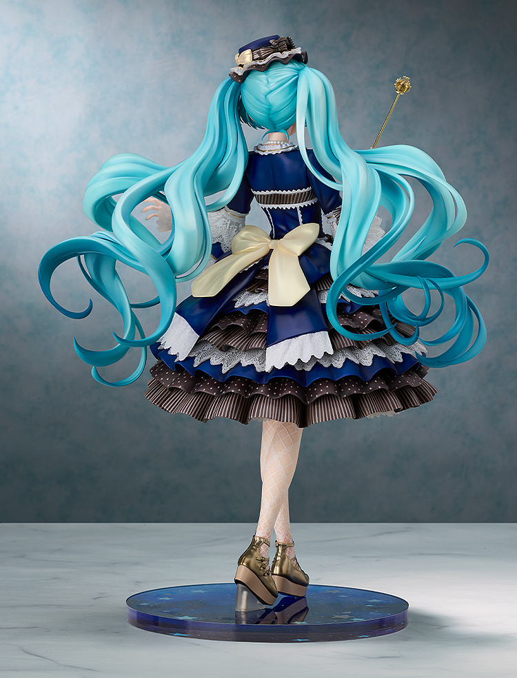 Figurine with long turquoise hair and a detailed outfit on a gray background