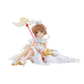Anime character figurine with wings and a staff on a white background