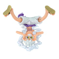 A small anime figurine of a character upside down with white hair, purple clothing, and gold shoes, standing on a cloud-like base against a plain white background.