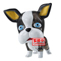 Dog figurine with blue eyes and a red label on a white background