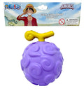 Purple gum-gum fruit toy with yellow handle from One Piece, featuring packaging above.