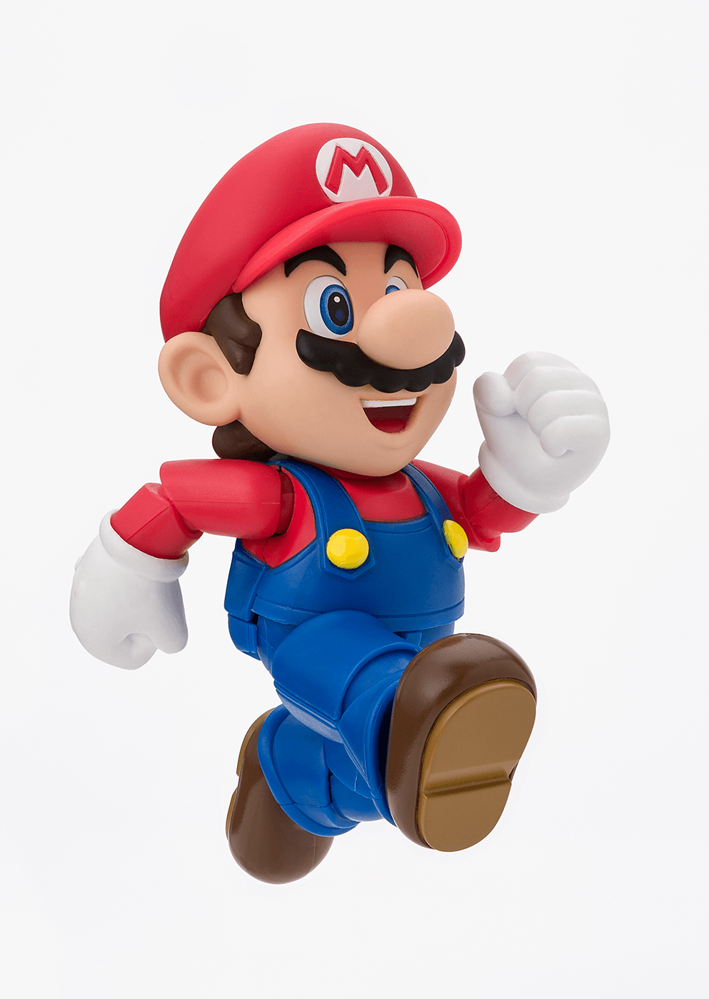 Super Mario figurine with red hat and blue overalls on a white background