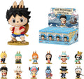 A collection of Monkey D. Luffy 'The Monsters One Piece' blind box figures, featuring a large main figure on a gold base next to its illustrated display box, with smaller figures of other One Piece characters lined up below on a white background.