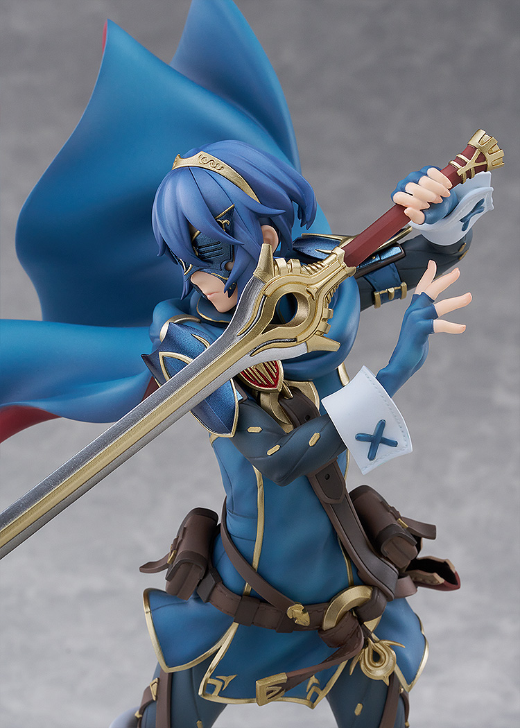 Figurine of a character with blue hair and armor, holding a weapon against a gray background