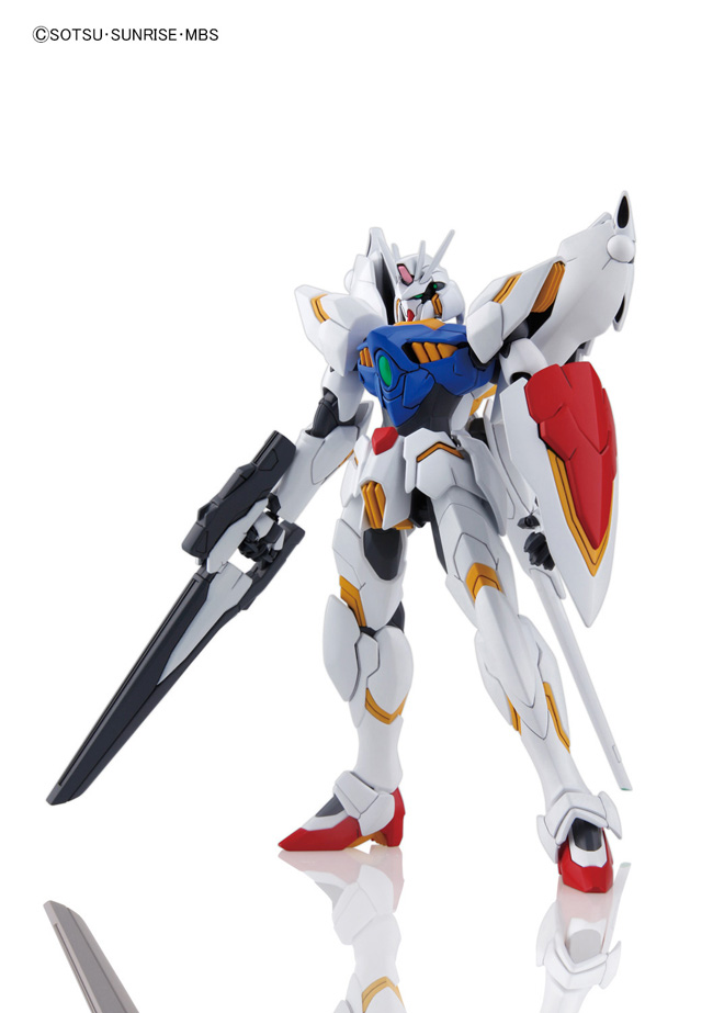 A white Gundam action figure holding a large black sword, with blue, red, and gold accents, photographed on a clean white background with a faint reflection below.