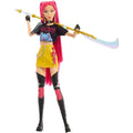 Toy figure with pink hair and colorful outfit holding a weapon on a white background
