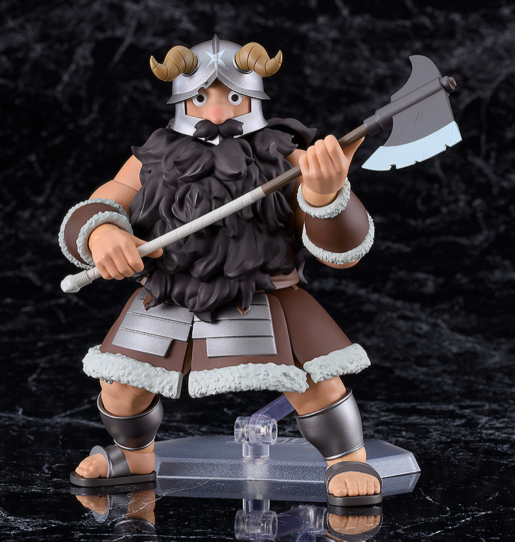 Figurine of a warrior character with armor and axe on a dark background