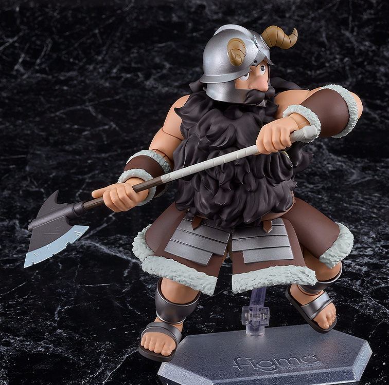Figurine of a warrior character holding an axe on a dark textured background