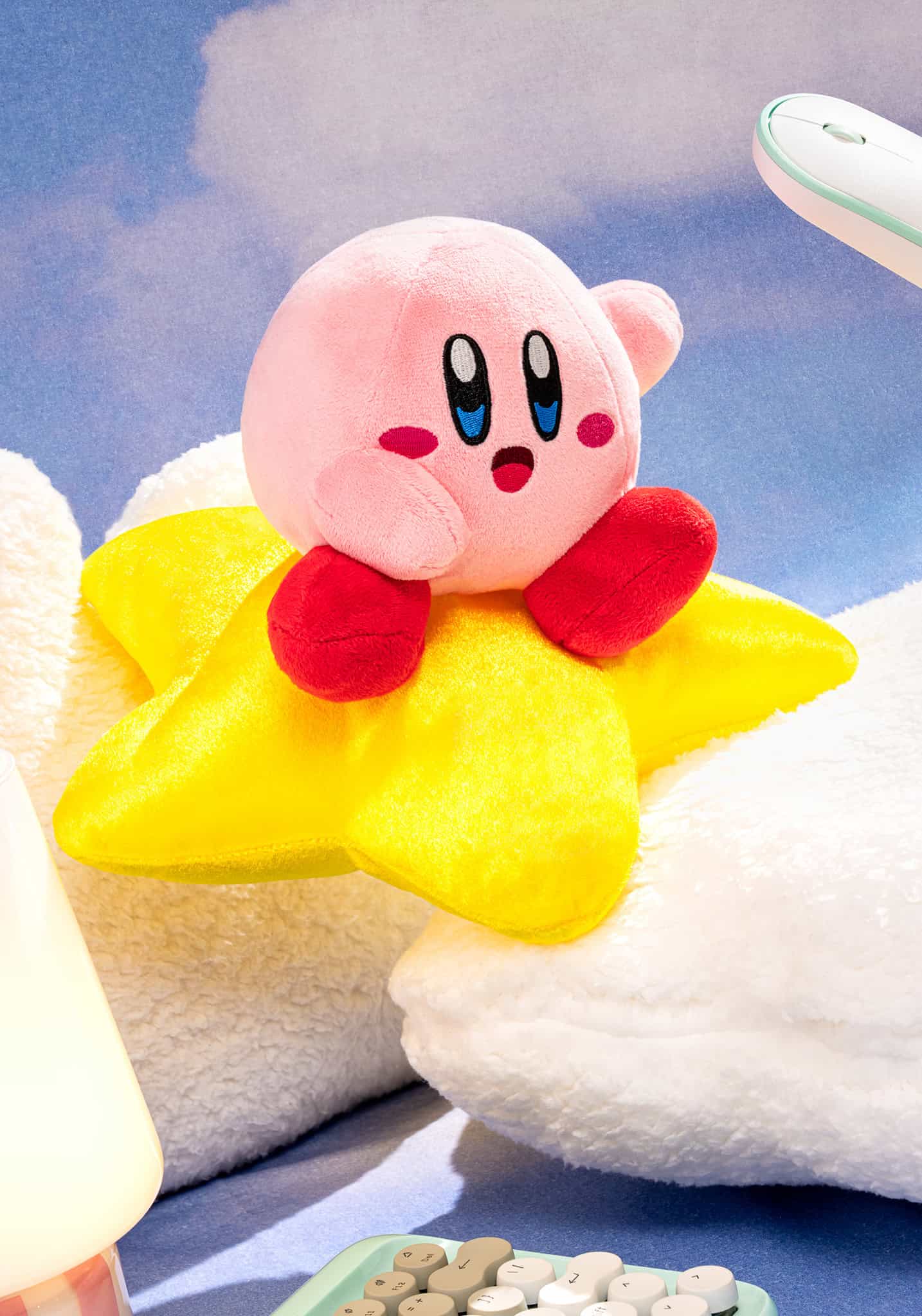 Plush toy resembling a character from a video game with a yellow star body and pink head.