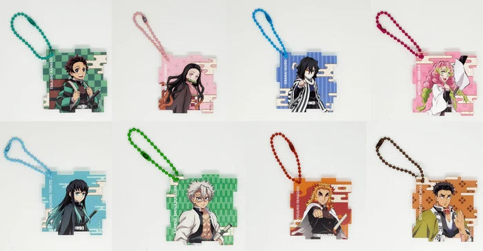 Eight anime keychain charms arranged in two rows on a white background. Each square charm features a different character from Demon Slayer, with its own colored bead strap.