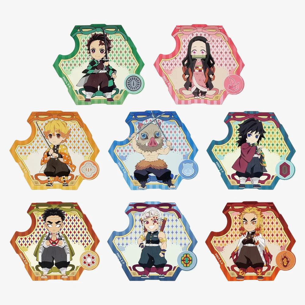 Eight anime character acrylic magnet from Demon Slayer, arranged in a 3x3 grid on a plain white background. Each standee has a colorful, patterned border and features a chibi-style character from the series.