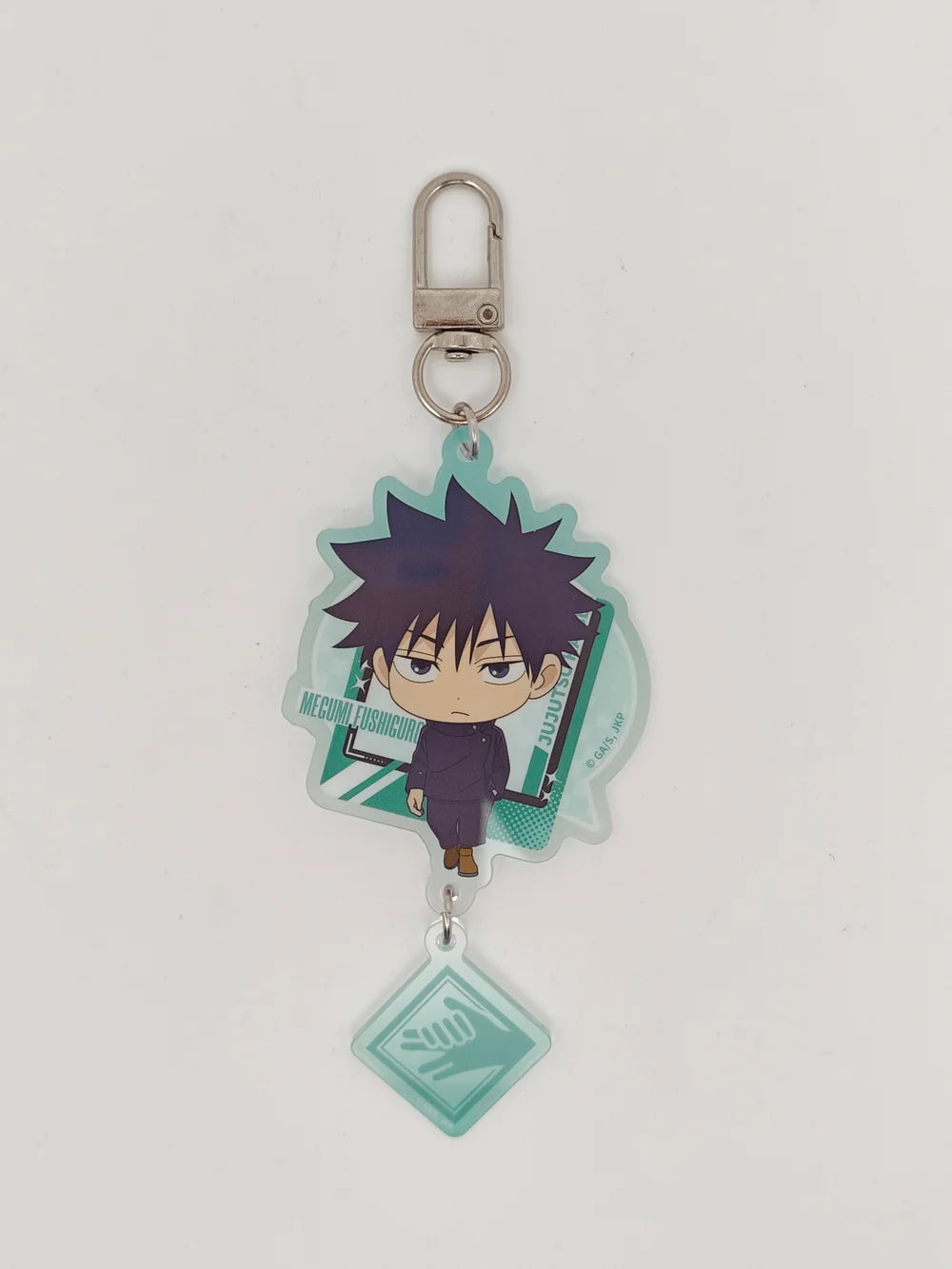 An acrylic keychain featuring a chibi anime character with spiky dark hair, set against a light teal background with a silver metal clasp and a dangling light teal square charm.