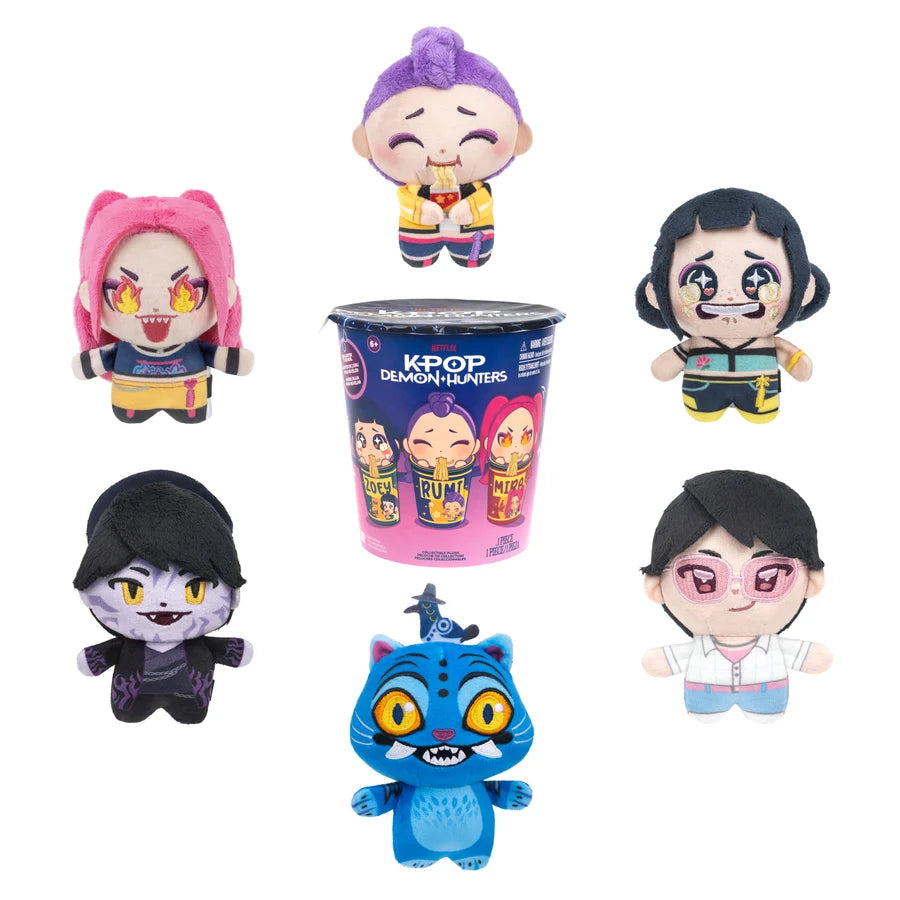 A set of six K-pop themed plush toys and a matching blind bucket, featuring characters resembling Jax, Layla, Haerin, Taehyung, Jungwoo, and Yoojung from the show Superhero Squad, arranged on a plain white background.