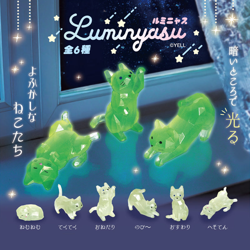 Six different glowing green and pale luminescent cat figurines displayed in front of a window-like background, with Japanese text and the brand name Luminyasu CYELL visible at the top.