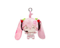 A pink plush character keychain featuring long floppy ears, cherry blossom details, and a metal key ring at the top, shown on a plain white background.