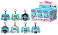Six small plush character keychains with turquoise ears and black key rings, shown alongside a matching retail display box. The characters have different outfits and instruments, including pink, green, black, gray, white, and blue tones.