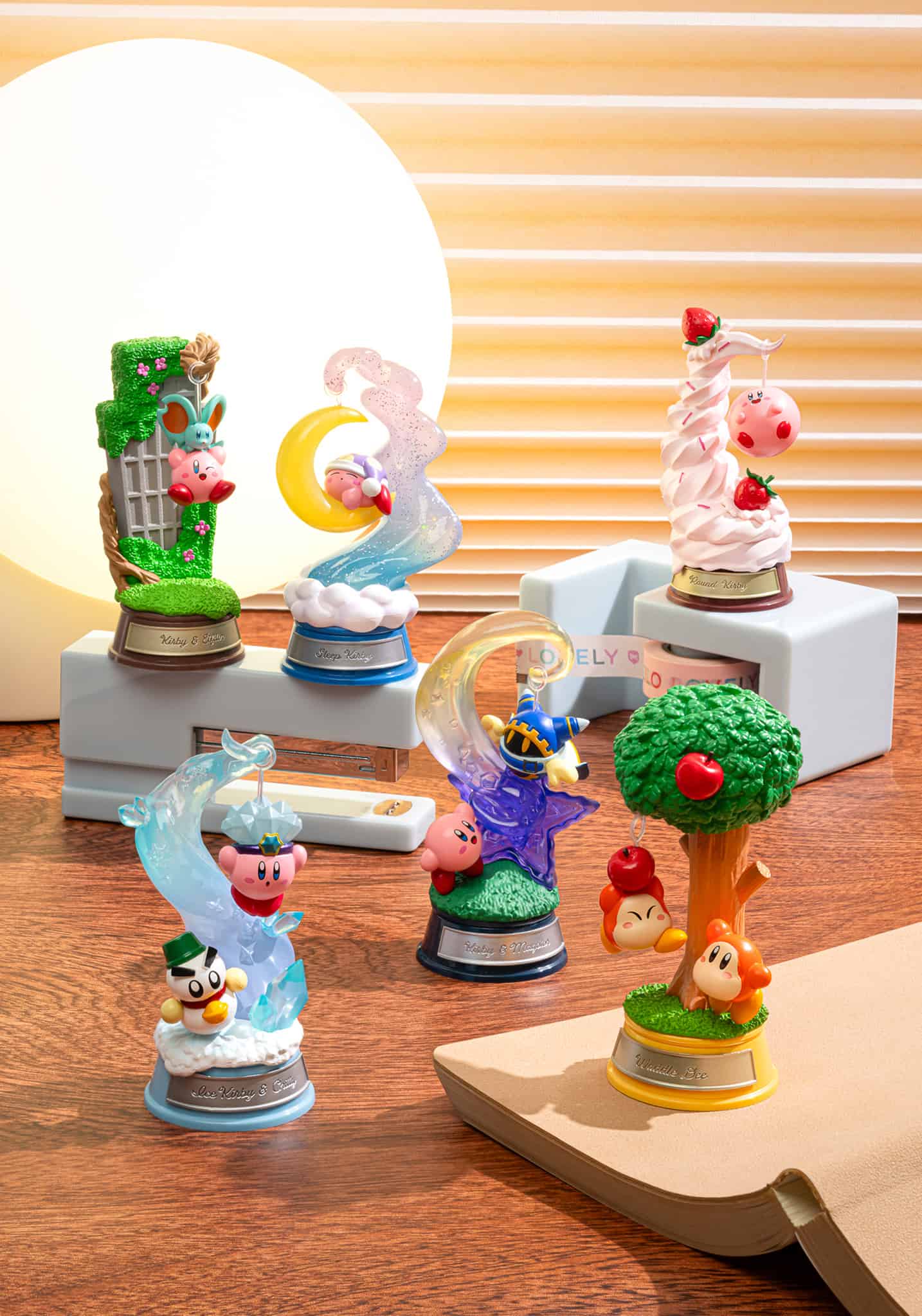 Collection of colorful figurines on a wooden surface with a blurred background