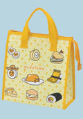 A yellow insulated tote bag with Gudetama illustrations and the Gudetama logo, set against a solid light blue background.