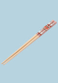 Chopsticks with cartoon rabbit design on a light blue background