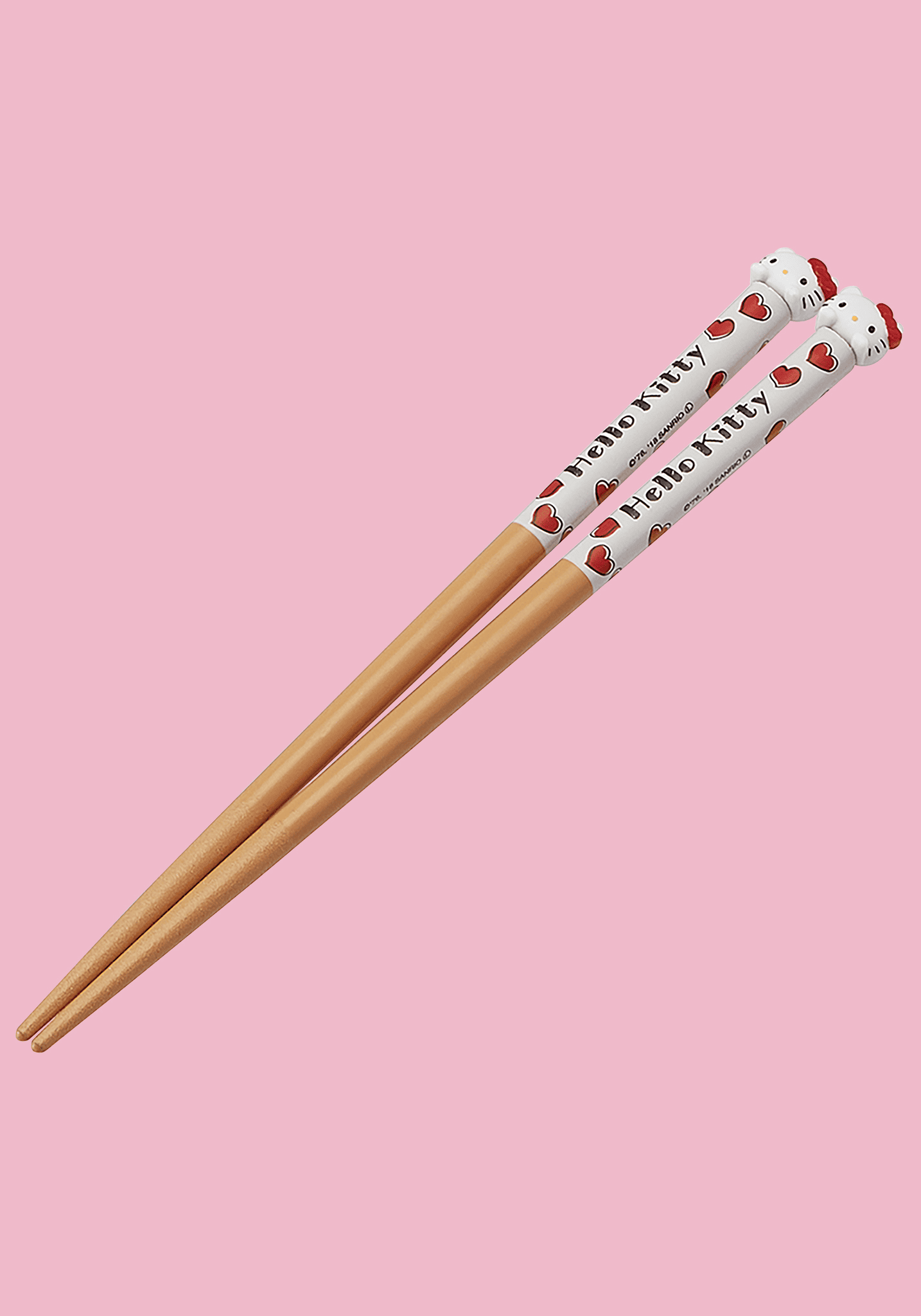 Wooden chopsticks with Hello Kitty design on a pink background
