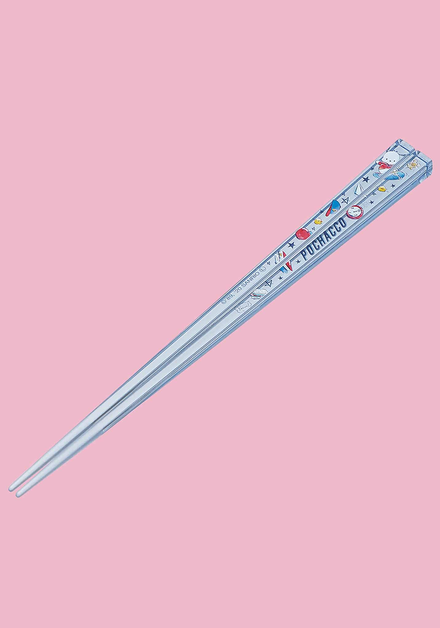Decorative ruler with cartoon designs on a pink background