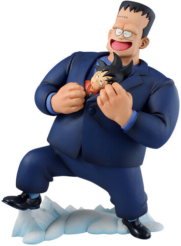 Figure of a character in a blue suit with a smaller character on the chest, standing on ice.