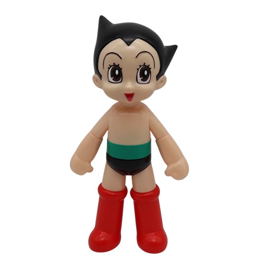 Toy figure of a character with black hair, red boots, and green underwear on a white background