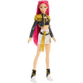 A fashion doll with long pink hair, wearing a black and gold cropped jacket, a white mini skirt with a gold sash, and black-and-white boots, shown against a plain white background.