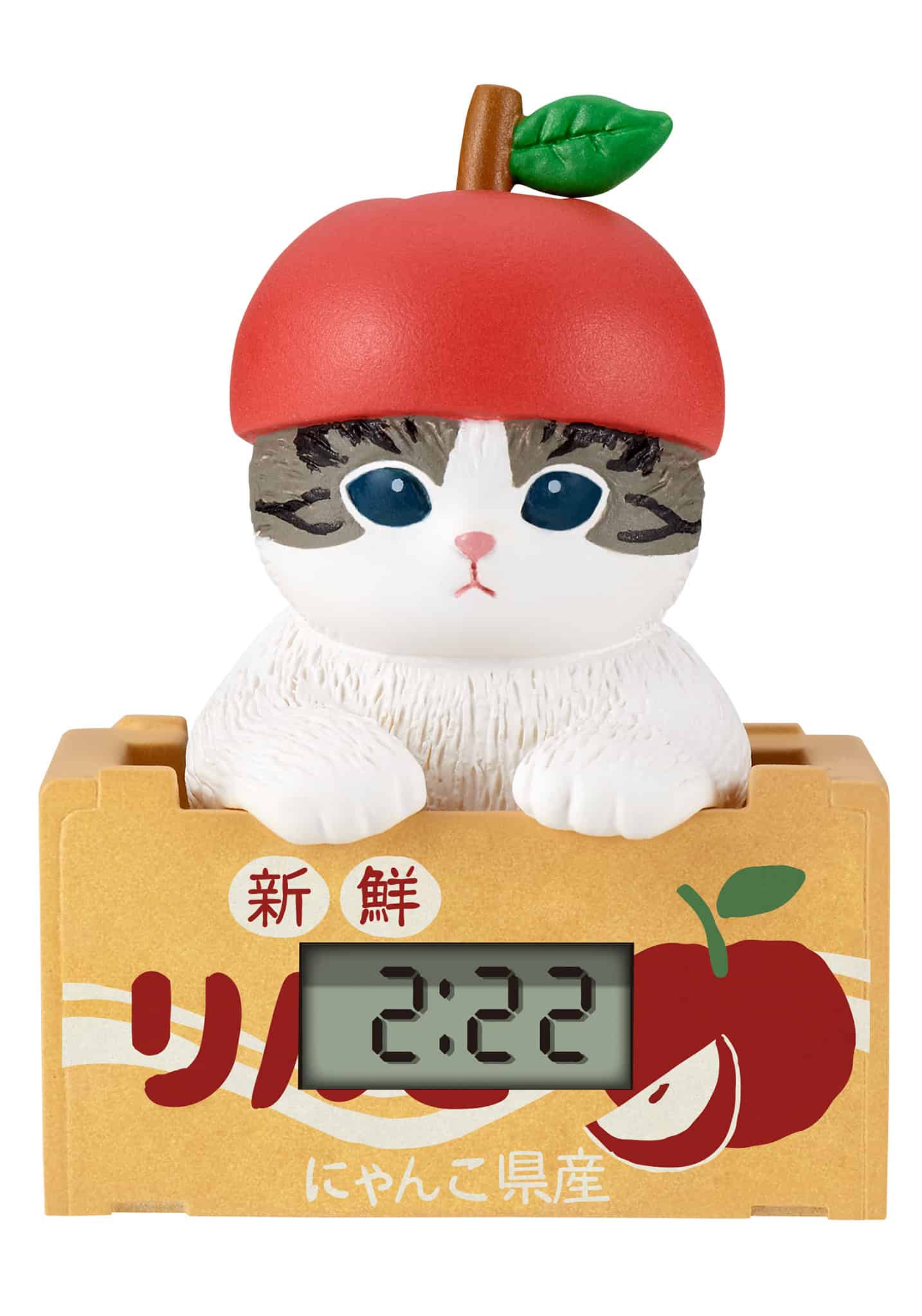 Cat-shaped clock with an apple on a white background