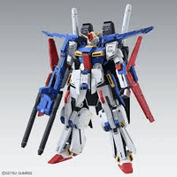 A small collectible model robot/mecha figure with a white body, blue upper body and wings, red lower body accents, and black weapon details, shown against a light gray gradient background.