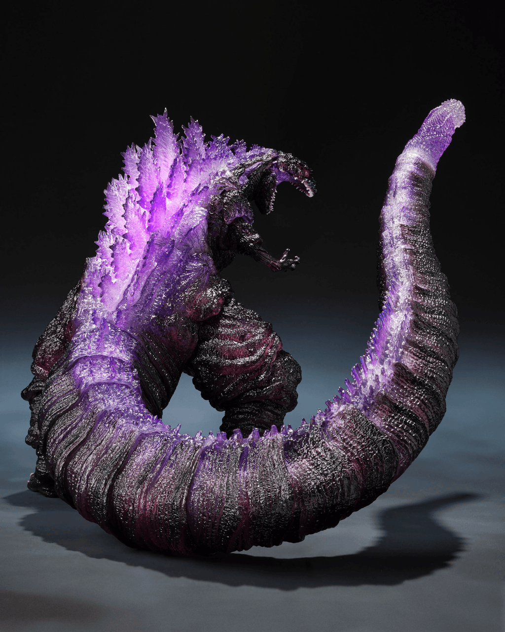 Monster-like creature with purple accents on a dark background